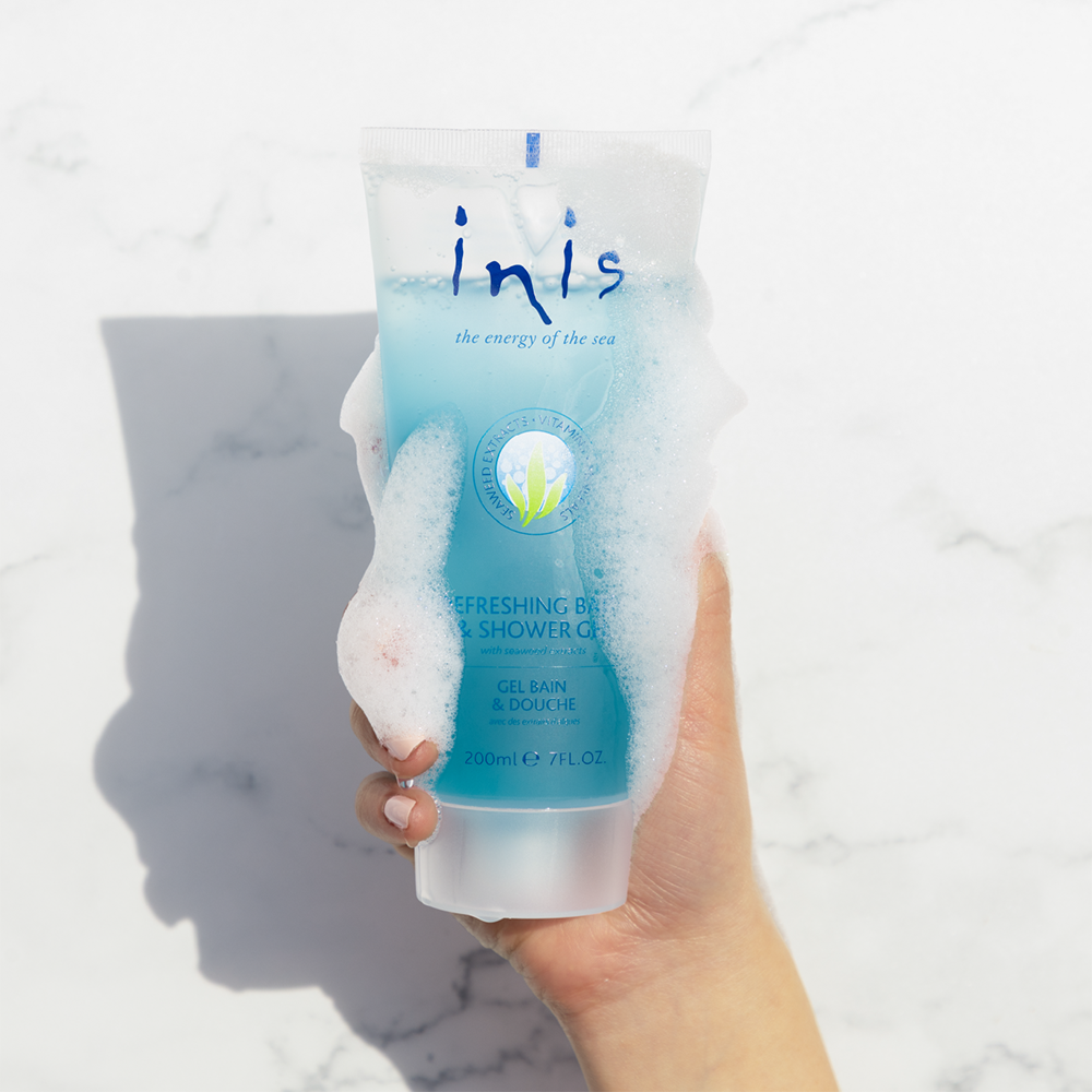 Tube of inis refreshing bath and shower gel on a white background