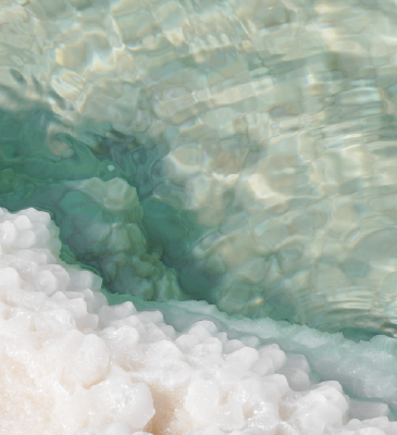 Close-up of the sea with sea mineral and salt crystals and clear water.